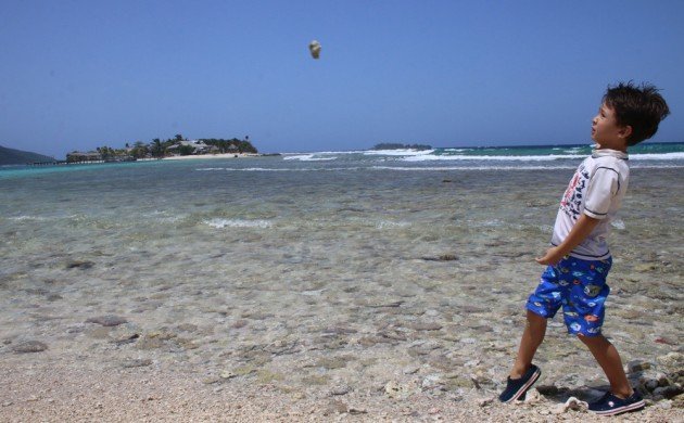 Desi throwing a rock